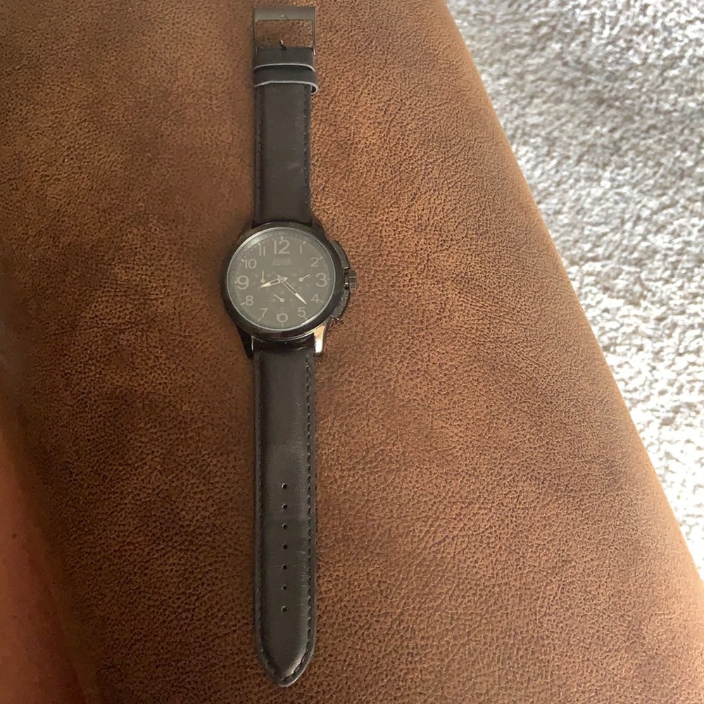 Men’s black Guess watch